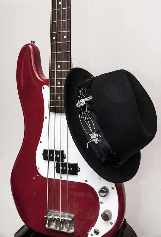 Author's hat with a composition of guitar strings