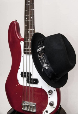 Author's hat with a composition of guitar strings